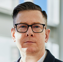 Alexander Hughes, egy kriptokereskedelmi vállalat élén álló vezérigazgató, portré